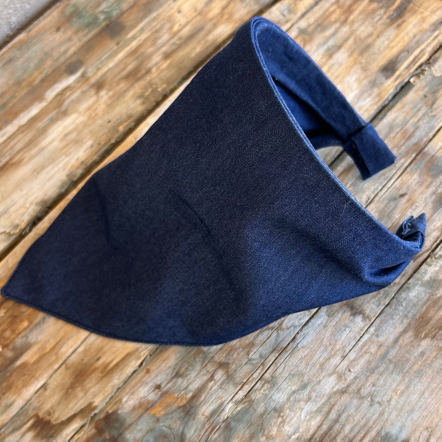 Navy blue fabric on a wooden surface