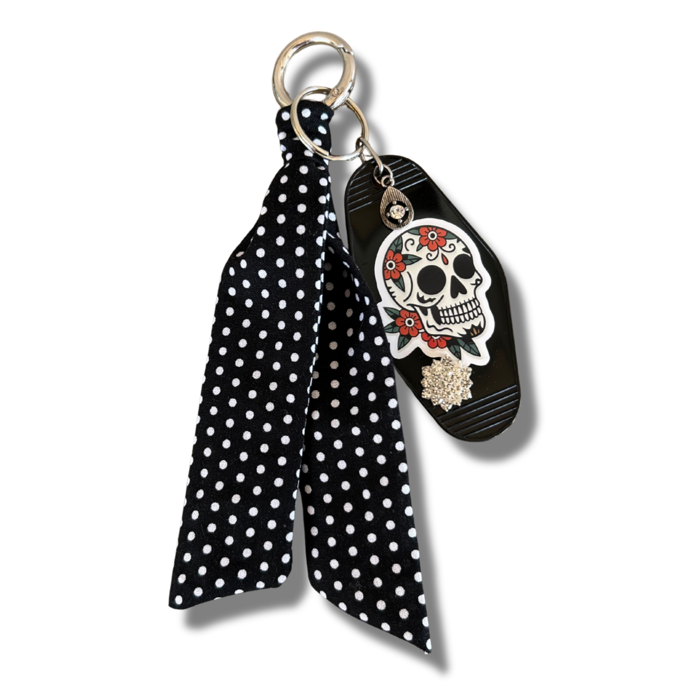 Sugar Skull image and a Black polka dot scarf keychain with skull design on a white background
