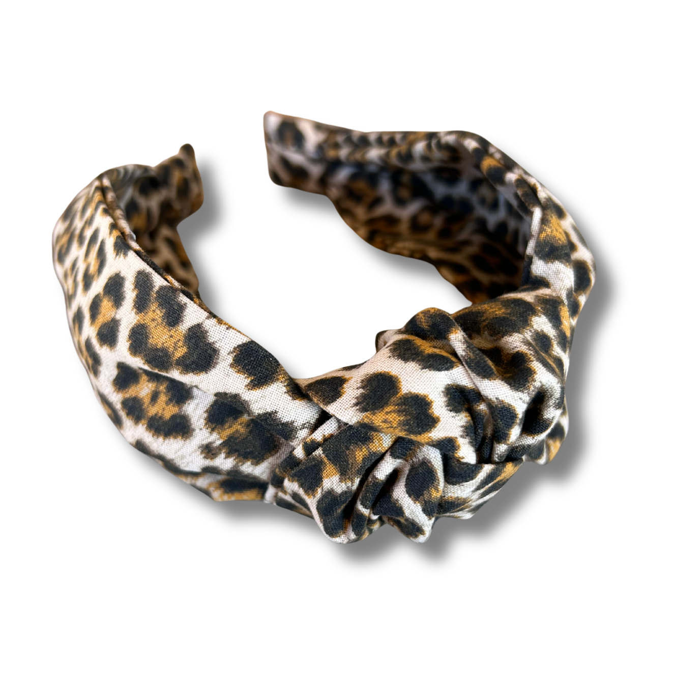 Leopard print headband on a white background