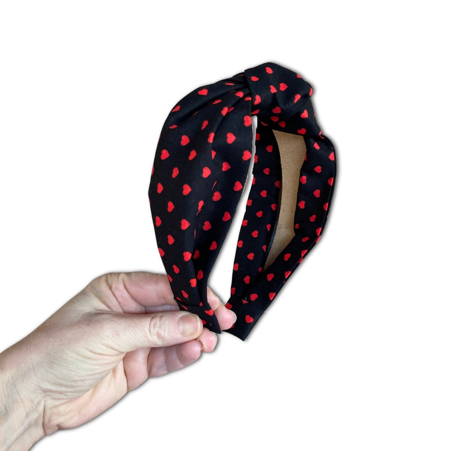 Headband with mini red heart polka dots with a black background