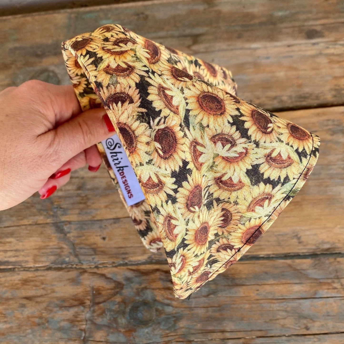 Womens head scarf with a fall daisy print. Material has been attached to a headband for easy styling.