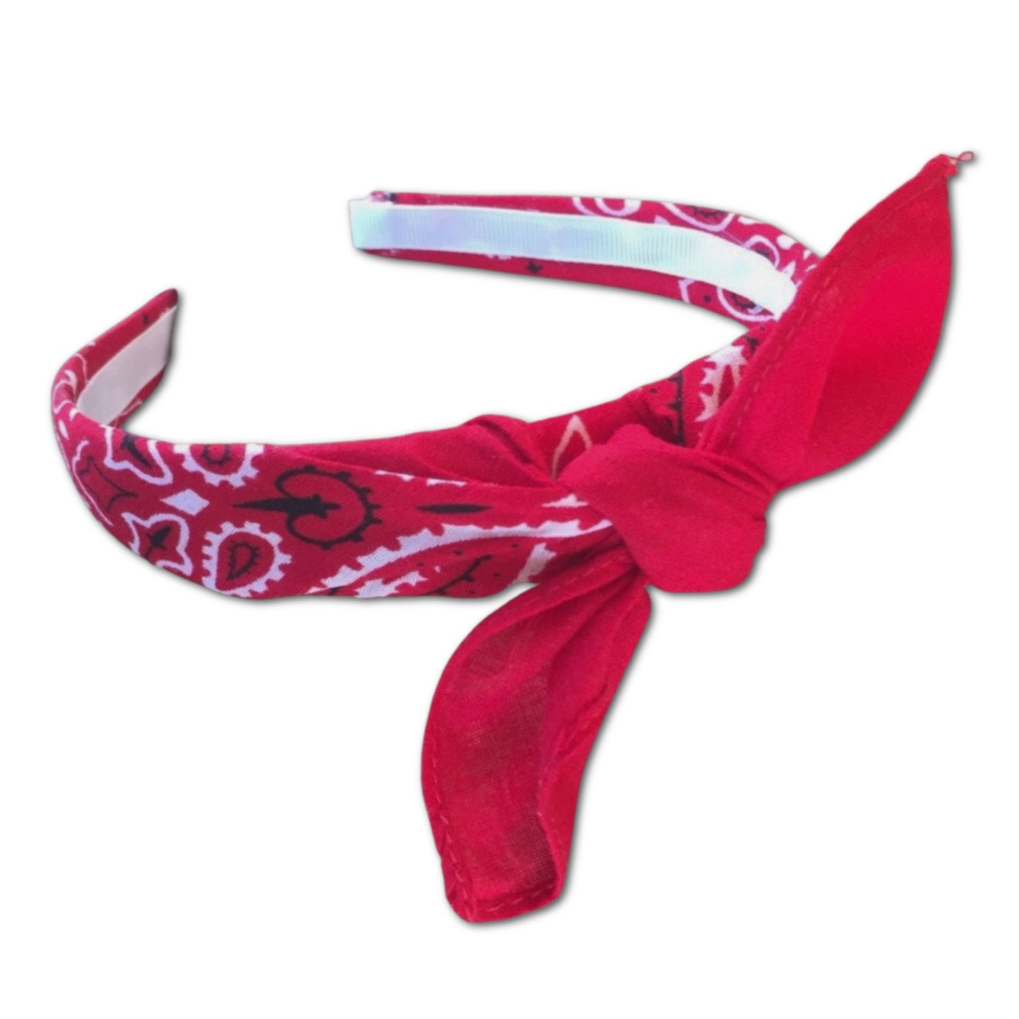 Red paisley kerchief bandana wrapped around plastic headband and tied in a knot