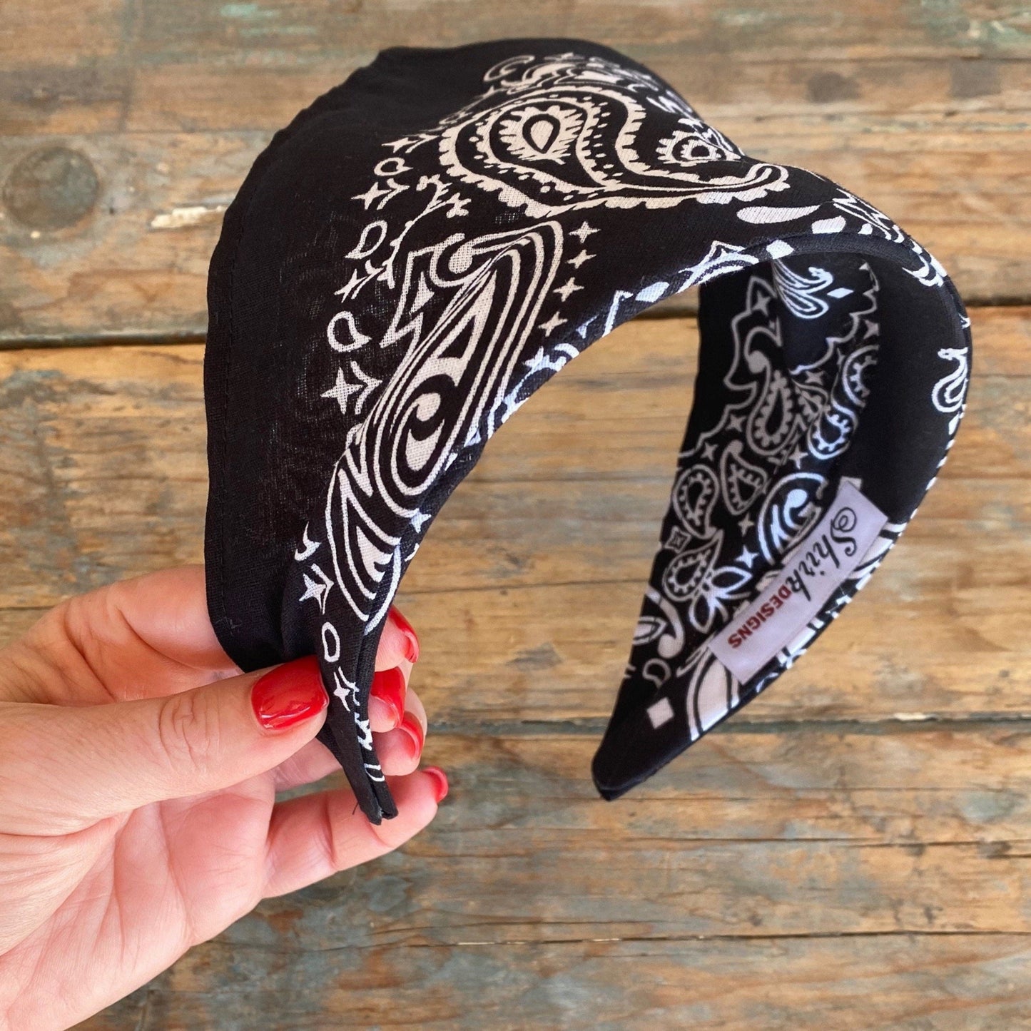 Black paisley bandana kerchief head scarf has been added to a comfortable headband. no more ties